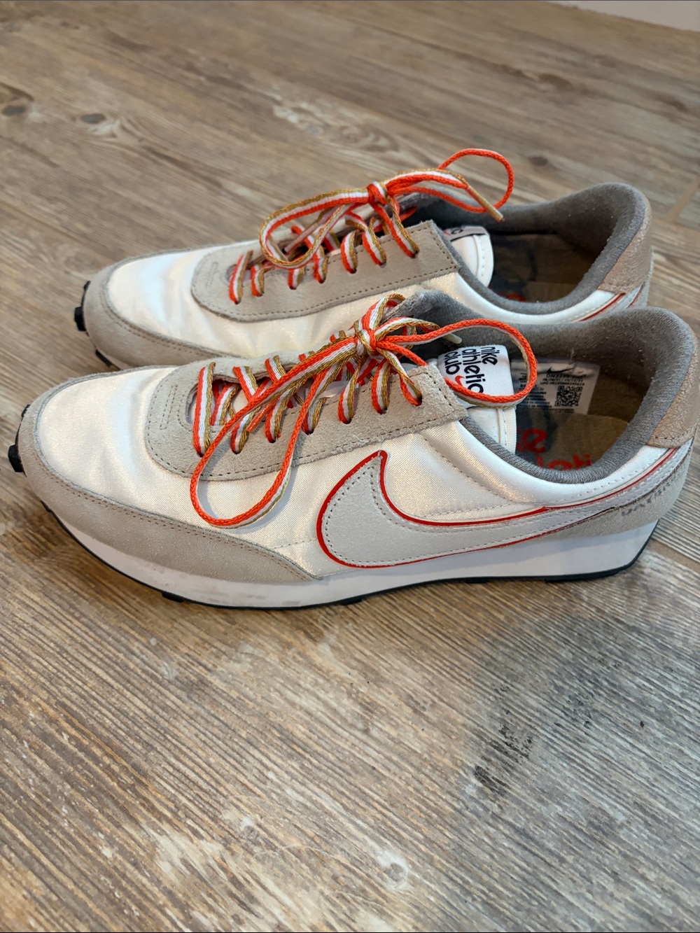 Nike women’s White, Gray and Orange Retro Sneaker